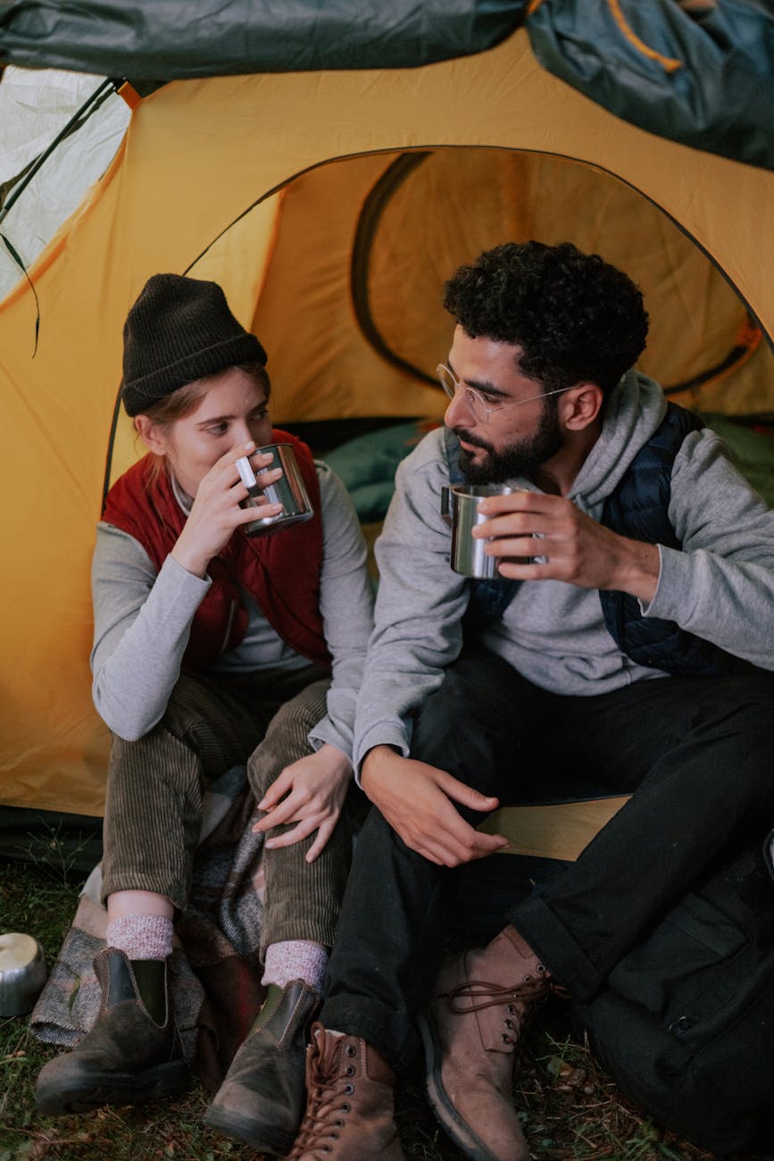 couple drinking from stainless cups